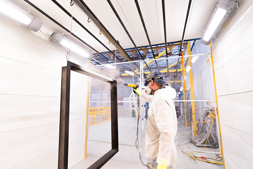 pncp1 Technician from a powdercoating perth company coating a metal for prime and corrosion protection