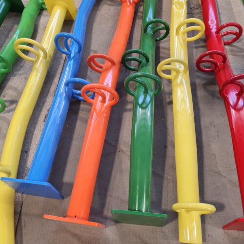 A cluster of vibrant metal poles showcasing the works of Precision Powdercoating in a variety of colors